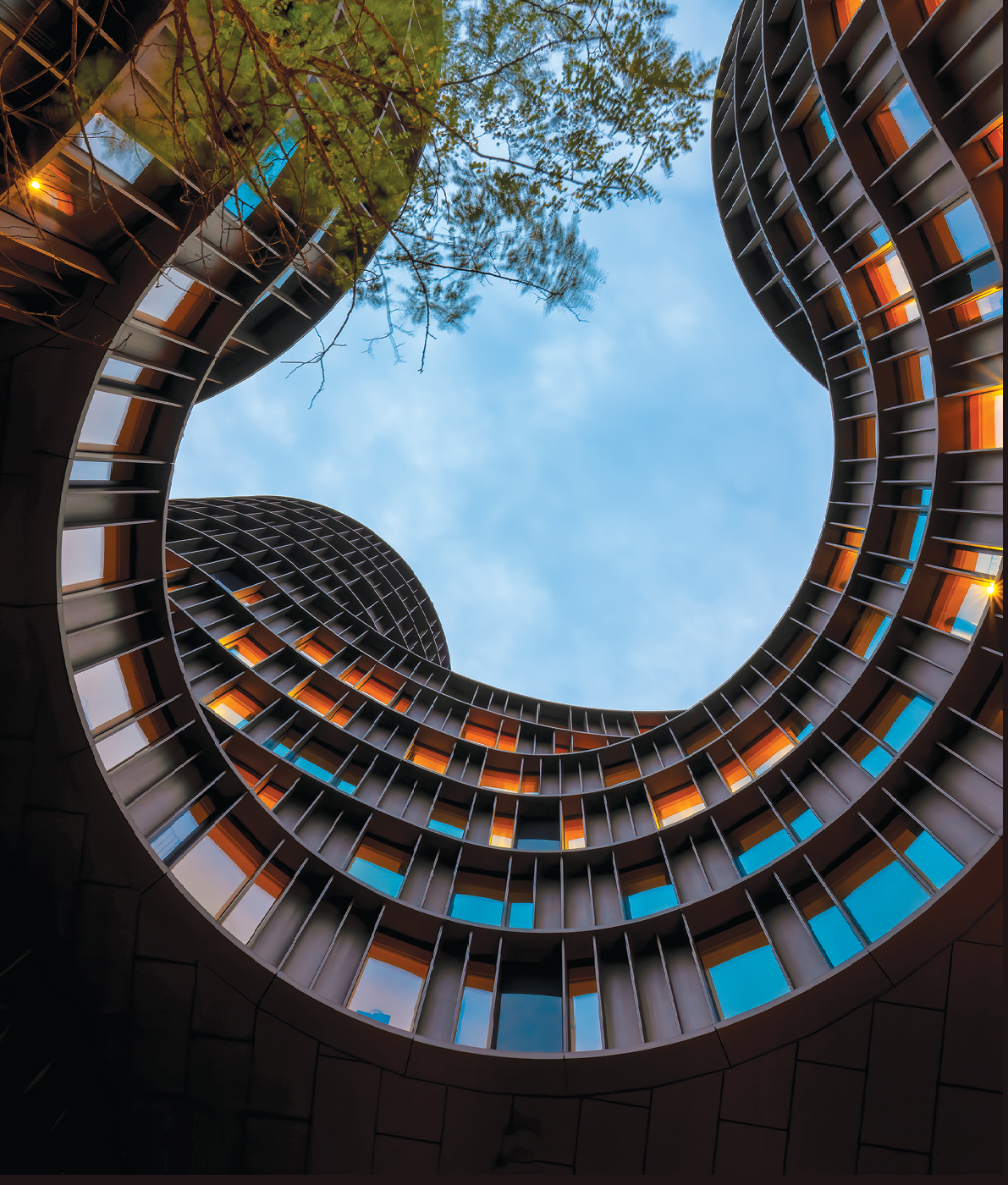 Copenhagen, Denmark - July 02, 2021: Axel Towers building view from the inner garden, example of new Danish architecture, space for living, work, recreation, entertainment